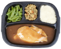 Turkey dinner with vegetables, side, starch, and main dish.